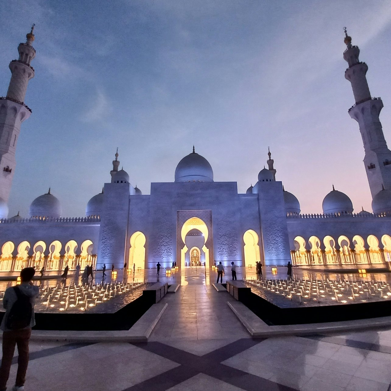 Experience the stunning architecture of the Grand Mosque featuring intricate mosaics and grand design followed by an exhilarating desert adventure with sandboarding and traditional entertainment.